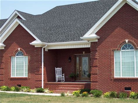 red brick house with light gray metal roof|shingles for red brick house.